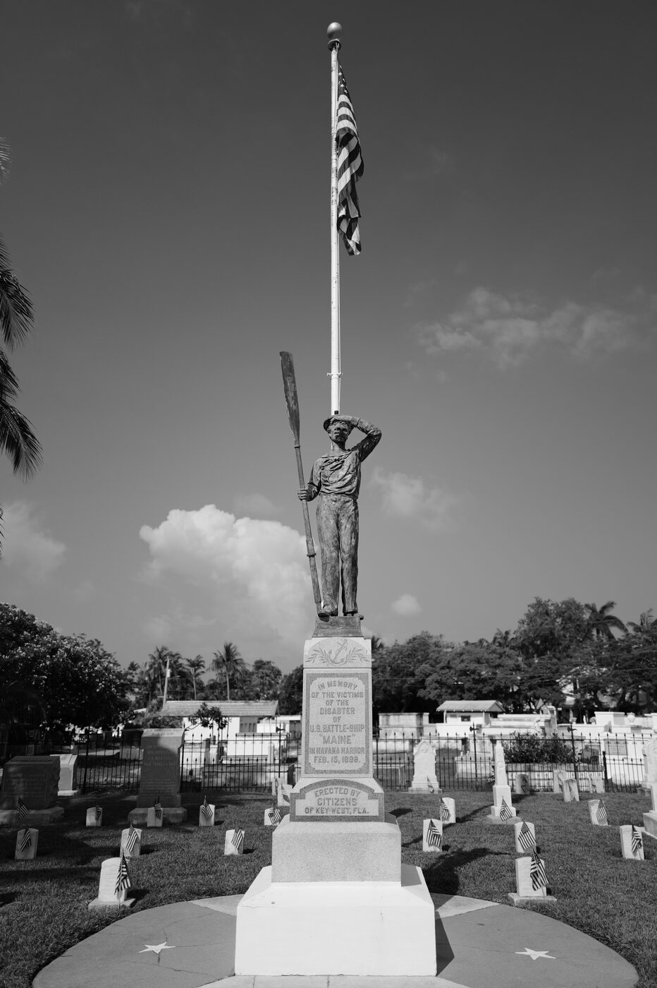 Veteran memorial statue with American flag
